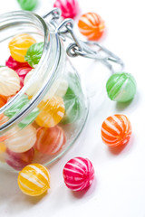 colorful round candies in a glass vessel