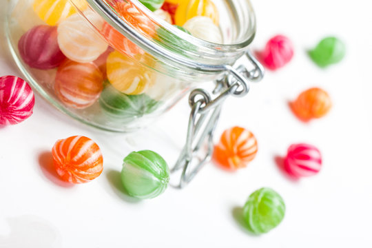 colorful round candies in a glass vessel