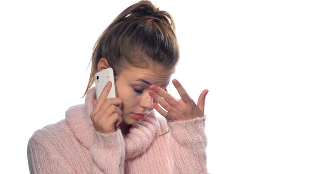 Beautiful blonde girl with long hair on the phone