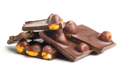 chocolate pieces with nuts on white