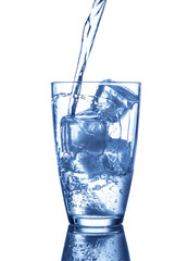 Glass of water with a splash and ice cubes