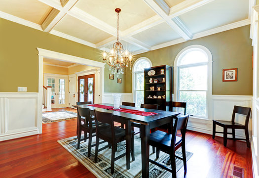 Luxury elegant green dining room with cherry floor.