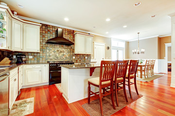 Luxury white kitchen with cherry hardwood