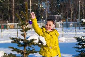 girl decorating christmas tree