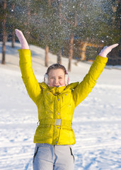 Girl throwing snow