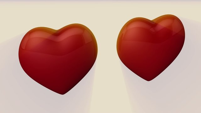 2 corazones 3d en movimiento