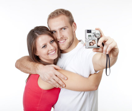happy young couple taking pictures