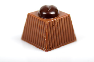 close chocolates on white background