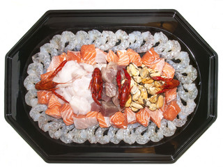 sea ​​food on a platter with different types of fish