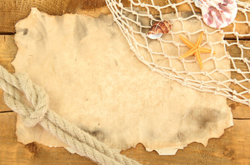 old paper, fishing net and rope on wooden table