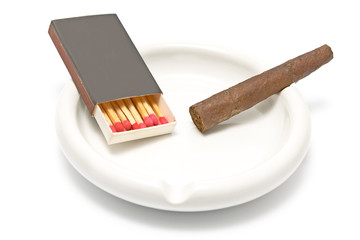 Cigar with matches and ashtray