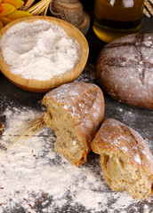 Rye bread on wooden table on wooden background close-up