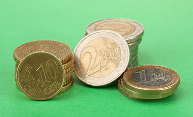 euro coins on color background