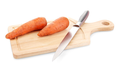 carrots and knife on wooden cutting board isolated on white