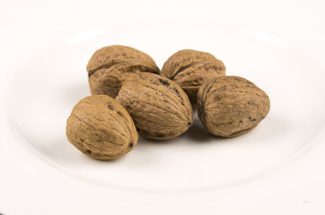 Closeup of Walnuts on white plate
