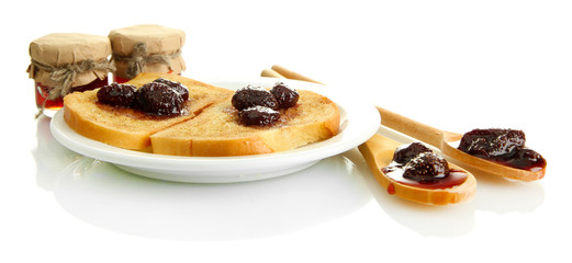 White bread toast with jam on plate, isolated on white