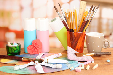 Artistic equipment: paint, brushes and art palette