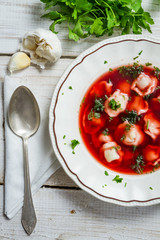 Plate of borscht with dumplings