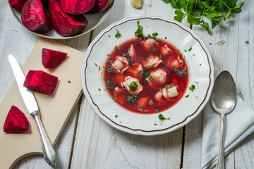 Fresh ingredients for borscht served in a rustic way