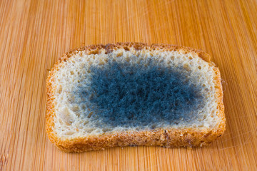 moldy bread on a chopping board