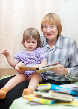 grandmother and child reading  book