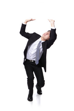 Business Man Holding Something Heavy Above Head