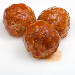 three meatballs under meat sauce