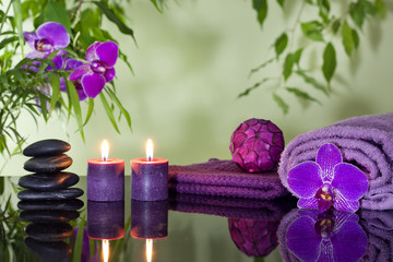 Zen stones orchid aromatic candles and towel spa concept