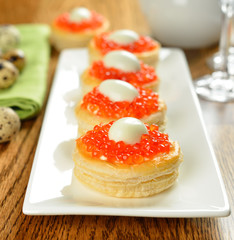 vol-au-vent with red caviar and quail eggs