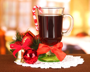 Hot tasty drink with christmas candy and other decorations