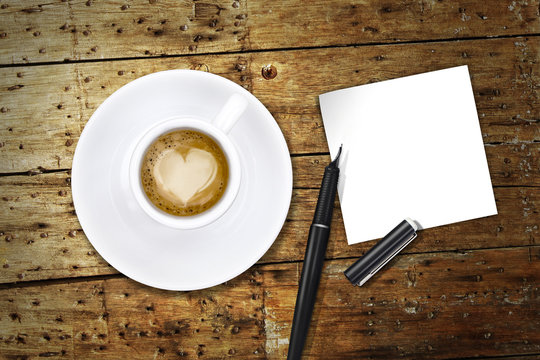 Heart coffee, with pen and notes