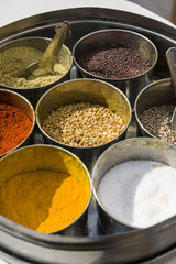 Set of Indian spices in metal bowls