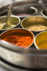 Close-up pf masala spices in metal bowls