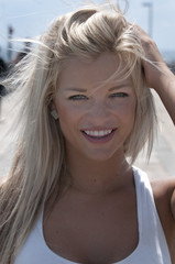 Beautiful blond woman on a pier