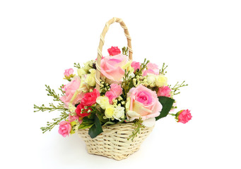 Fototapeta na wymiar Beautiful roses in a white basket isolated on white