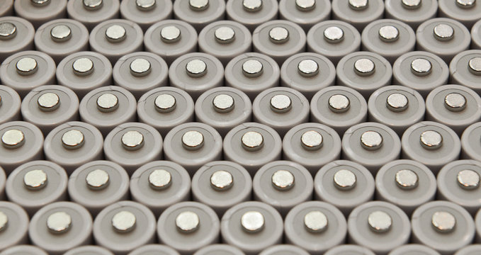 Several AA batteries in perspective closeup view