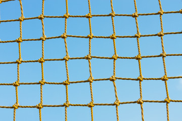 yellow net against the blue sky