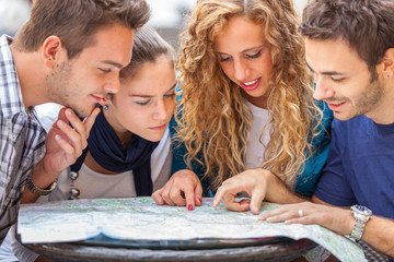 Group of Tourists Looking at Map