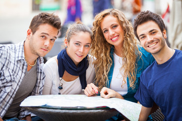 Group of Tourists Looking at Map