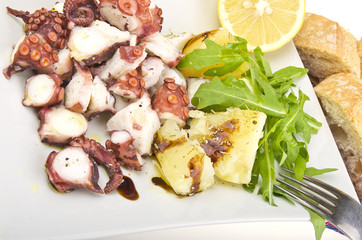 octopus salad with lemon slice lettuce and potatoes