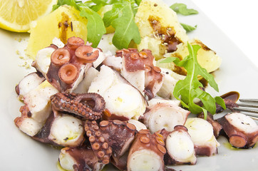 octopus salad with lemon slice lettuce and potatoes
