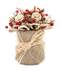 Colorful dried flowers in burlap sack