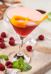 Red drink with raspberries and passion fruit