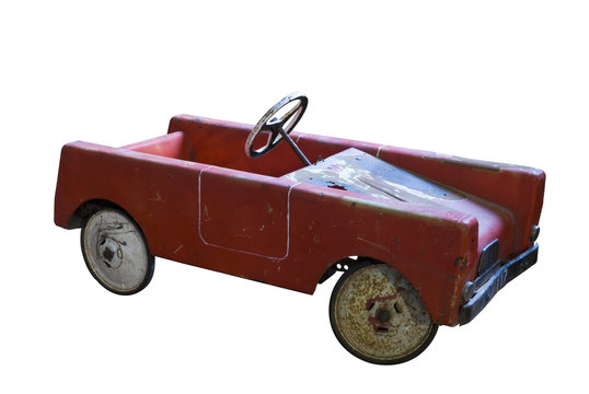 Old red pedal car, isolated on white, clipping path included.