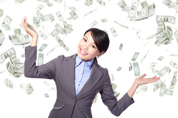 Business woman happy under money rain