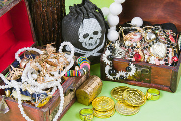 two small boxes with treasures on a light green background