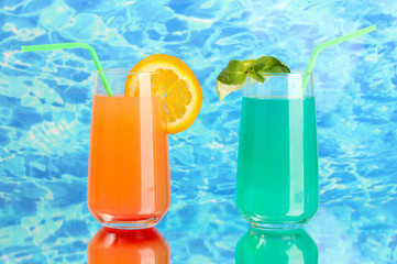 Two cocktails on blue background