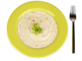 Mashed potatoes in green plate isolated on white