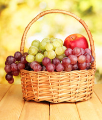 Grape in basket on wooden table