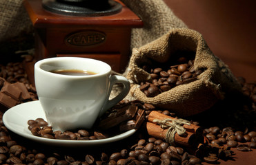 cup of coffee, grinder, turk and coffee beans